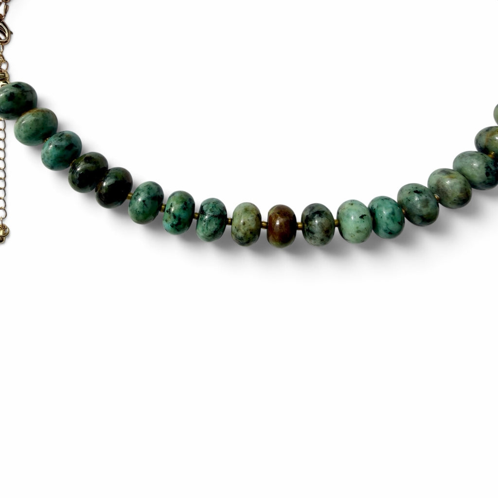 OTTO & NOVA natural stone beaded necklace featuring disc-shaped beads in forest green and moss tones with metal clasp.